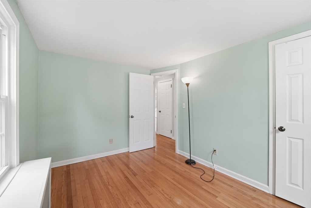 1636 Longmeadow Street Longmeadow, MA 01106 - Photo 15 of 33 a view of a room with wooden floor and brick walls
