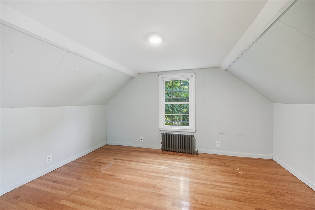 1636 Longmeadow Street Longmeadow, MA 01106 - Photo 20 of 33 an empty room with wooden floor and windows