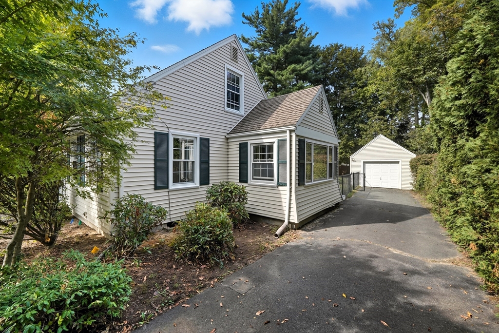 1636 Longmeadow Street Longmeadow, MA 01106 - Photo 4 of 33 a view of a house with a yard plants and large tree