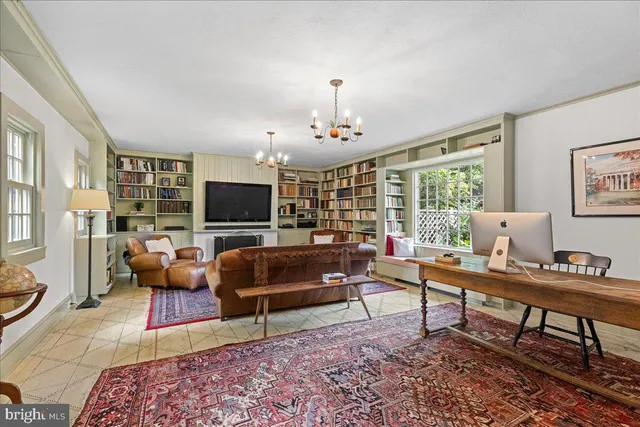 a bedroom with a bed and a book shelf
