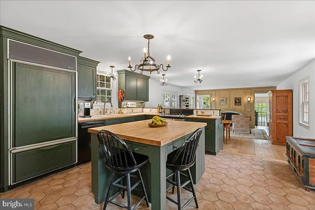 a kitchen that has a sink and a stove in it