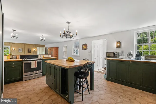 a front view of a house with a yard and a garage