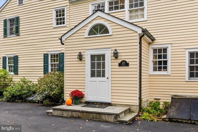 a bathroom with a toilet a sink and tub
