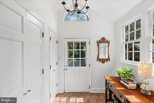 a spacious bedroom with a bed and a fireplace