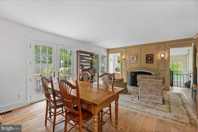 a view of an entryway with wooden floor and a window