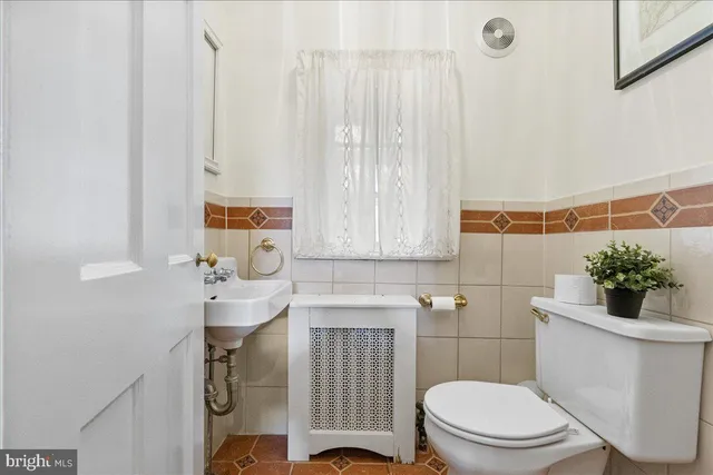 a bedroom with a bed and a dresser in it