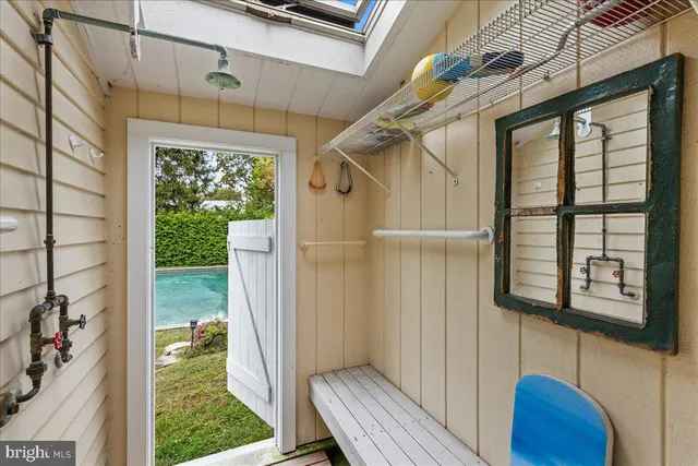 an aerial view of residential houses with city view