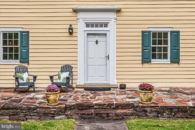 a view of a livingroom with furniture and stairs