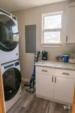 a utility room with sink dryer and washer