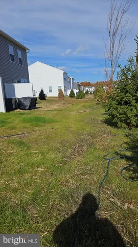 a view of a large building with a yard
