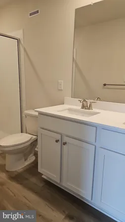 a bathroom with a toilet and a bathtub