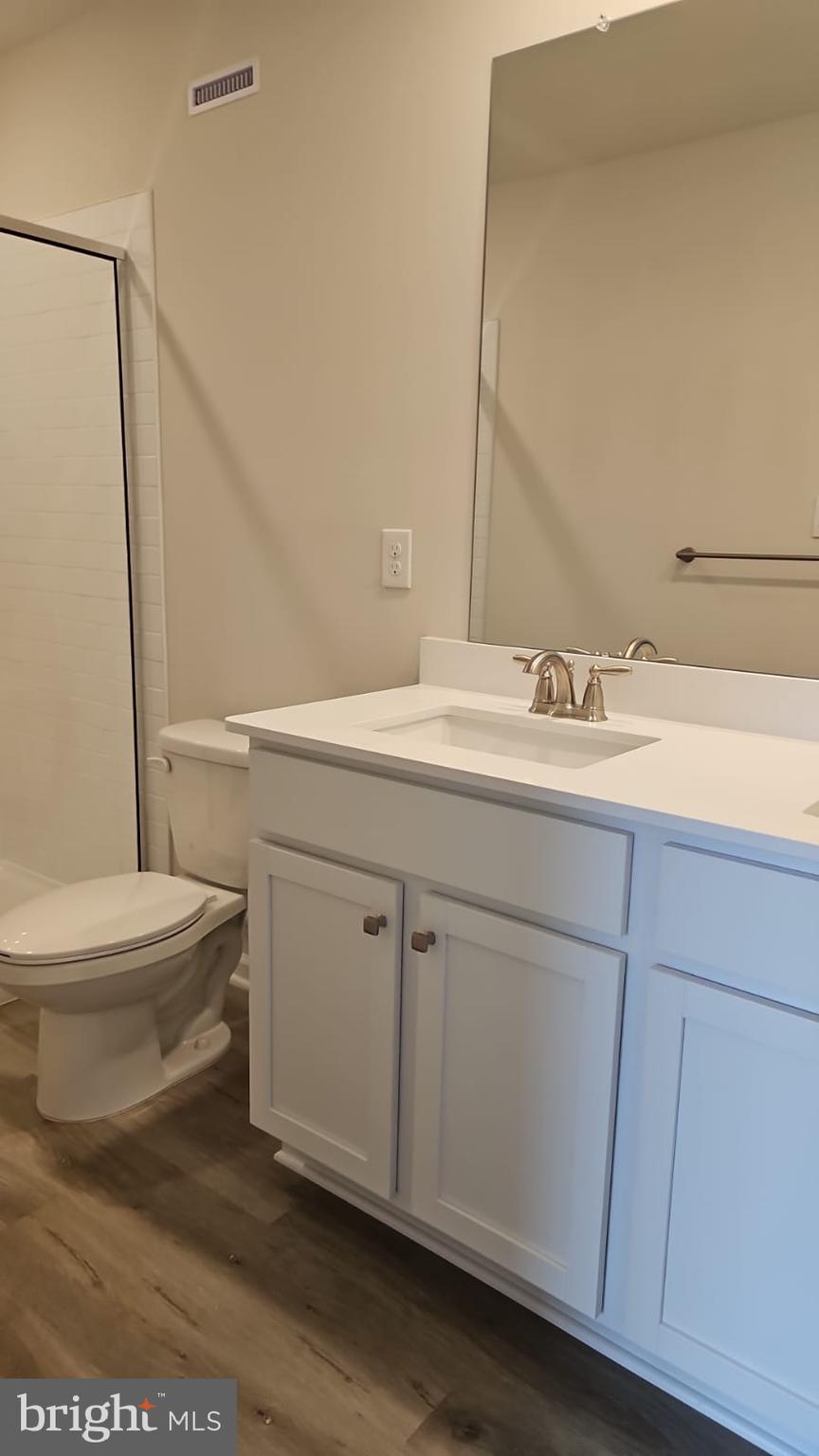 18 Elliot Lane Westampton, NJ 08060 - Photo 26 of 38 a bathroom with a sink a toilet and a mirror