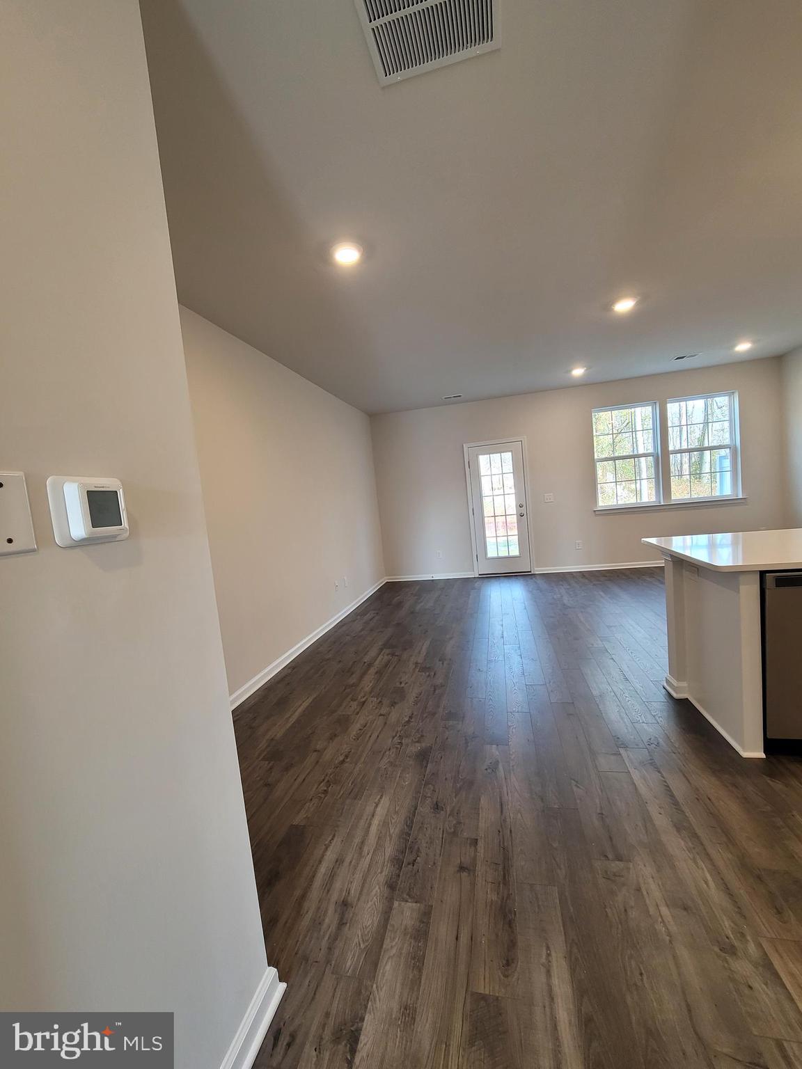 18 Elliot Lane Westampton, NJ 08060 - Photo 4 of 38 an empty room with wooden floor and windows