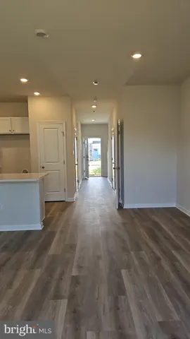 a view of a kitchen with a sink and cabinets