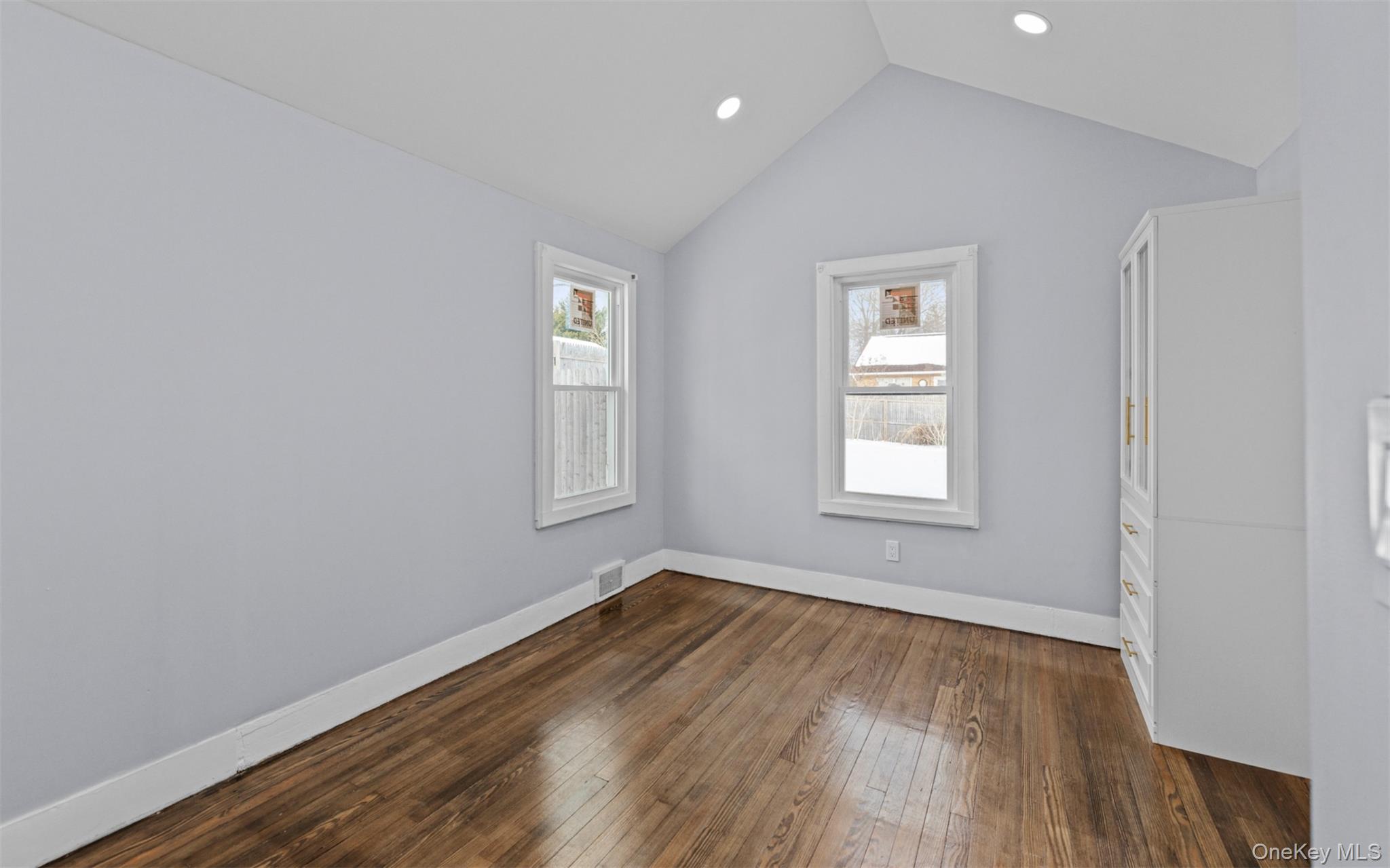 61 Eastview Road Ronkonkoma, NY 11779 - Photo 13 of 27 wooden floor in an empty room with a window