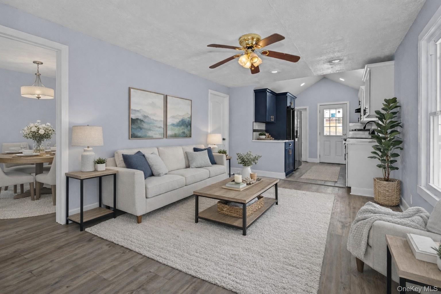 61 Eastview Road Ronkonkoma, NY 11779 - Photo 4 of 27 a living room with furniture and chandelier