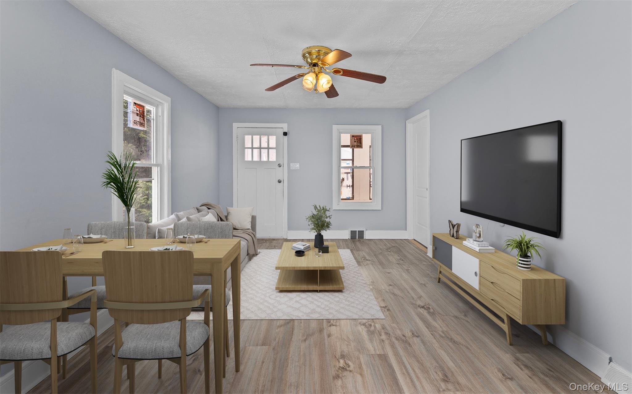 61 Eastview Road Ronkonkoma, NY 11779 - Photo 6 of 27 a living room with furniture and a flat screen tv