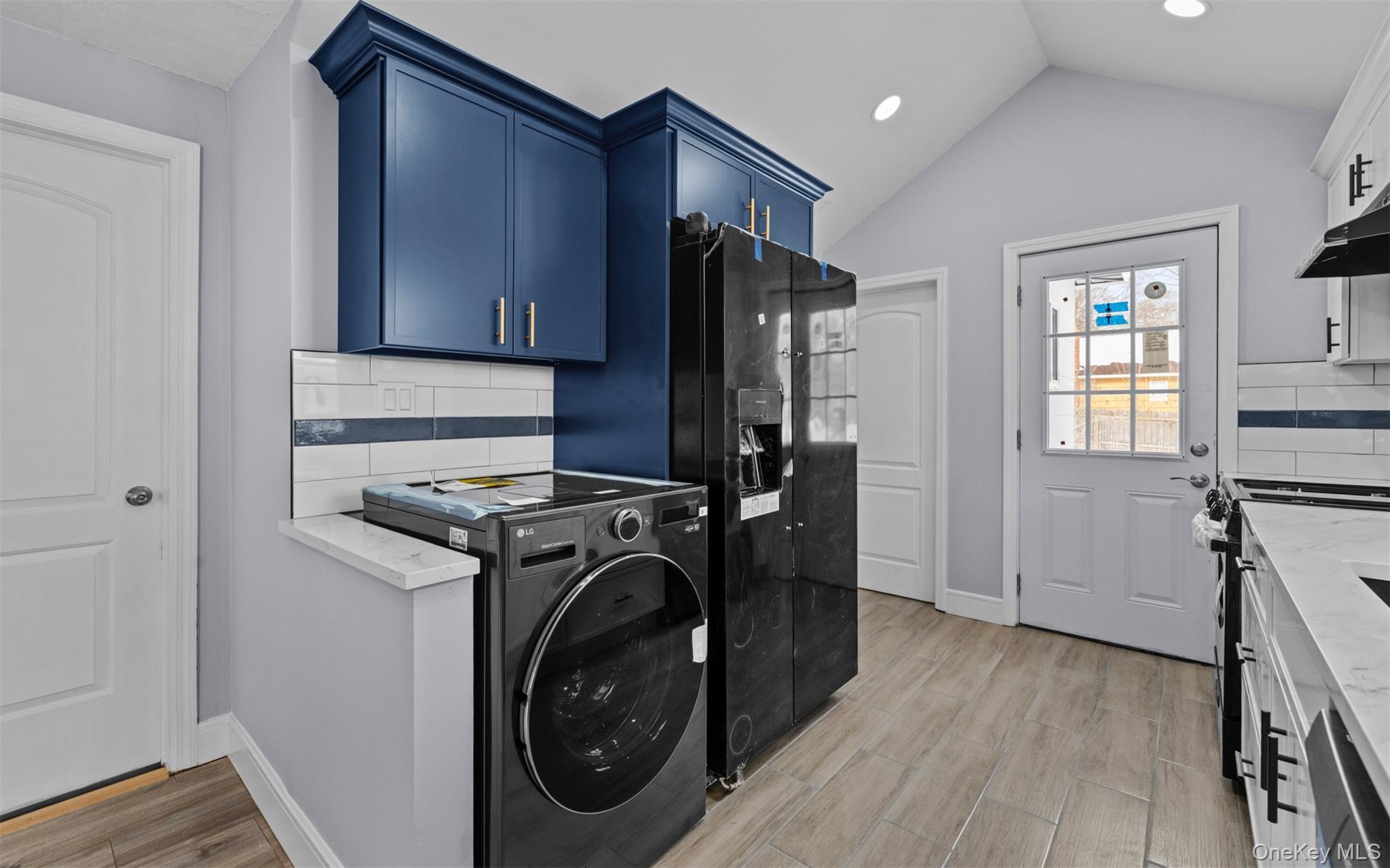 61 Eastview Road Ronkonkoma, NY 11779 - Photo 9 of 27 a view of a kitchen with washer and dryer