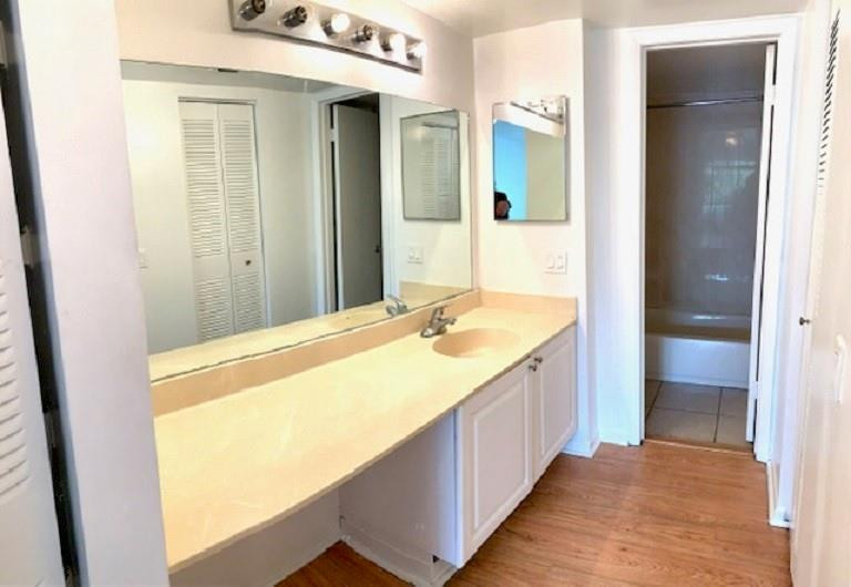 721 North Pine Island Road, Unit 213 Plantation, FL 33324 - Photo 17 of 34 a bathroom with a granite countertop sink and a mirror