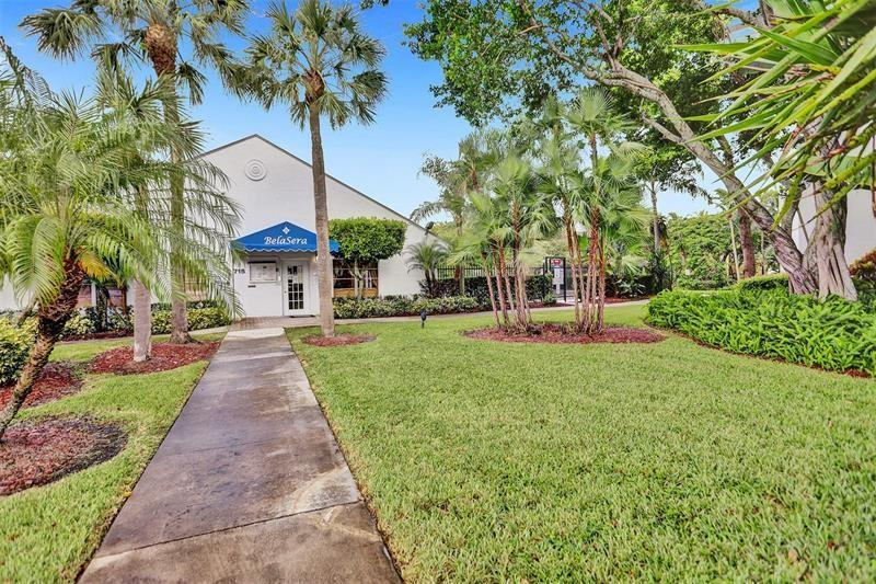 721 North Pine Island Road, Unit 213 Plantation, FL 33324 - Photo 30 of 34 a front view of a house with a yard and fountain