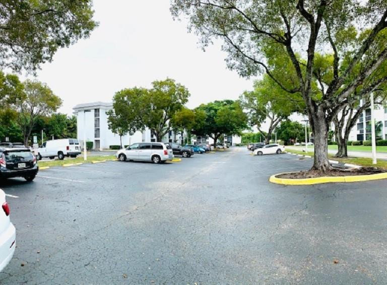 721 North Pine Island Road, Unit 213 Plantation, FL 33324 - Photo 31 of 34 a view of a street with parked cars