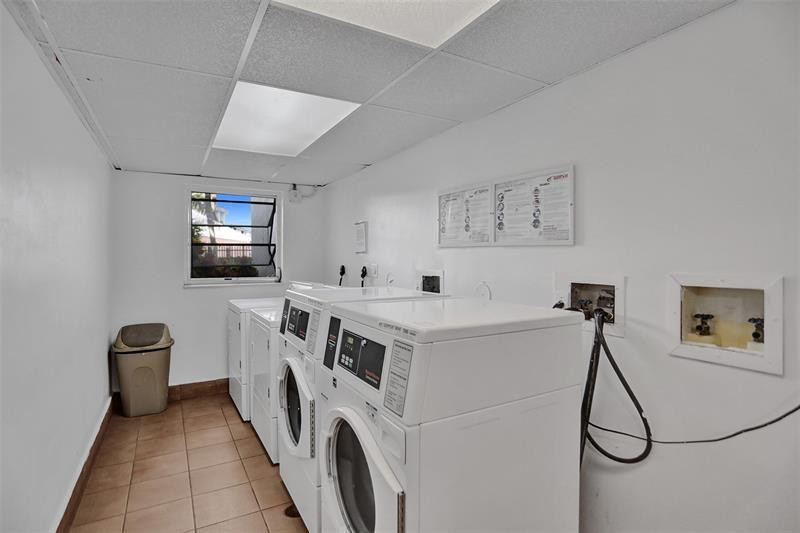 721 North Pine Island Road, Unit 213 Plantation, FL 33324 - Photo 33 of 34 a view of a livingroom with washer and dryer