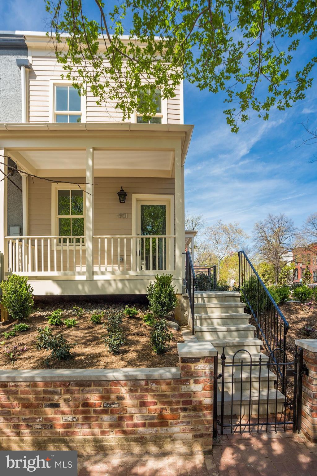 401 11th Street Southeast Washington, DC 20003 - Photo 2 of 27 a front view of a house with a yard