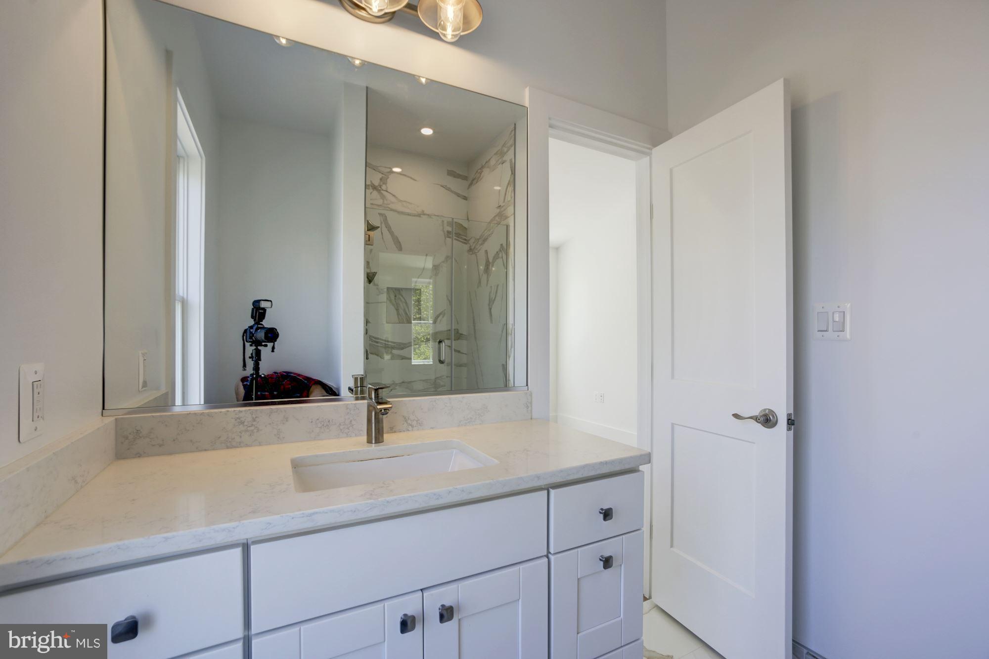 401 11th Street Southeast Washington, DC 20003 - Photo 16 of 27 a bathroom with a sink and a mirror