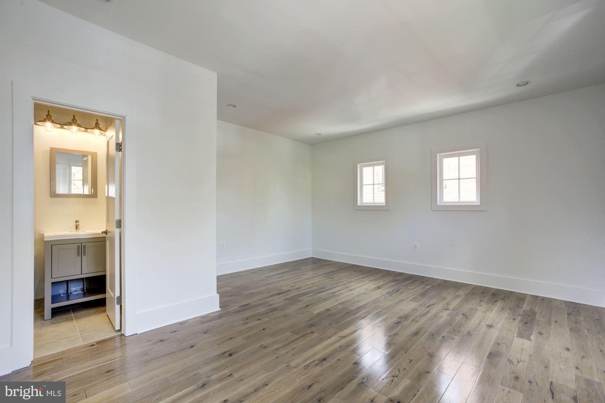 401 11th Street Southeast Washington, DC 20003 - Photo 24 of 27 a view of an empty room with wooden floor and a window