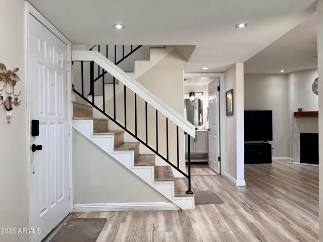 a view of staircase with lots of frames and equipment