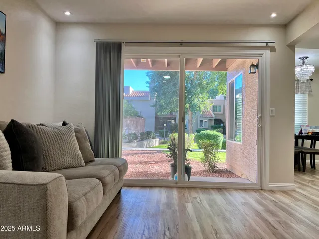 a living room with furniture and a large window