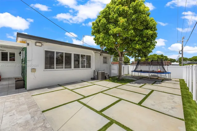 a house with trees in front of it