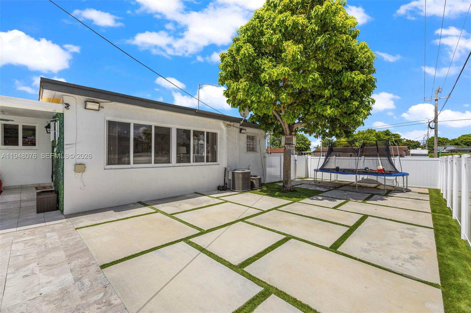 8631 Southwest 16th Terrace Miami, FL 33155 - Photo 24 of 39 a house with trees in front of it