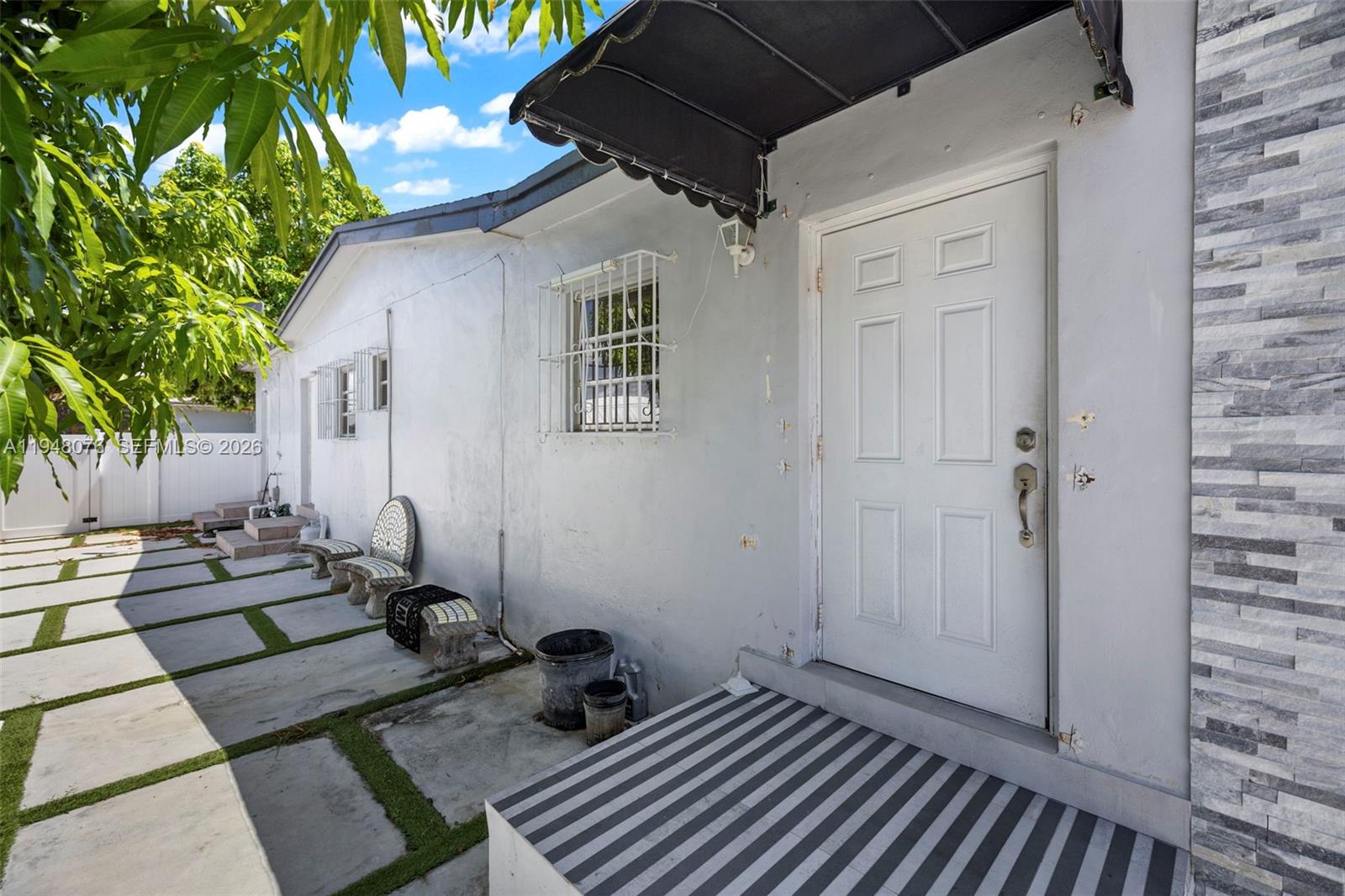 8631 Southwest 16th Terrace Miami, FL 33155 - Photo 29 of 39 a backyard of a house with seating space