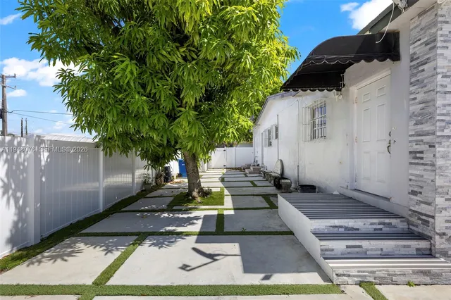 a view of a backyard with sitting area