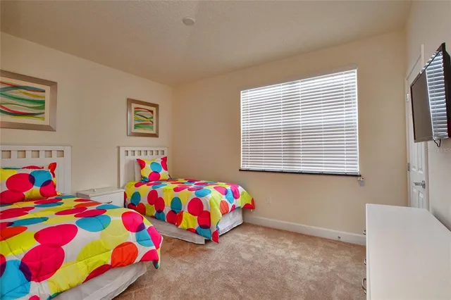 a room that has a bed and a dresser in it