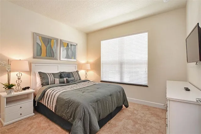 a bedroom with a bed and a cabinets