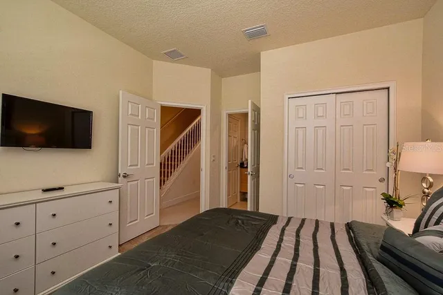 a view of a livingroom with furniture and staircase