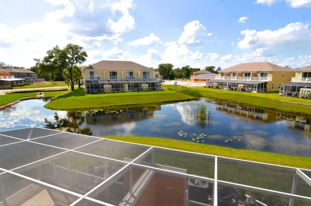 a front view of a house with a garden and plants