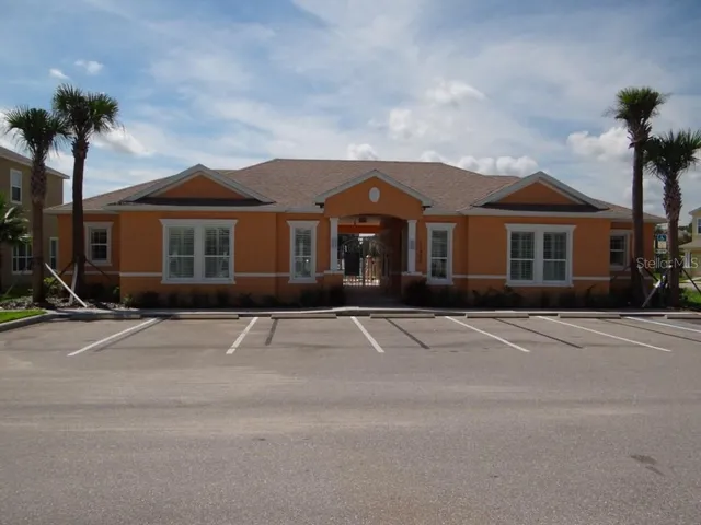 a bedroom with furniture and a wooden floor