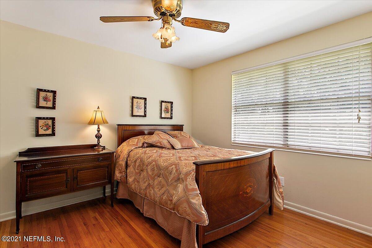4064 Heath Road Jacksonville, FL 32277 - Photo 15 of 23 a bedroom with a bed and a window