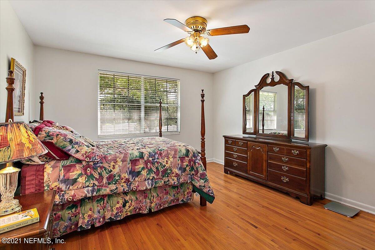 4064 Heath Road Jacksonville, FL 32277 - Photo 16 of 23 a bedroom with a bed and a dresser