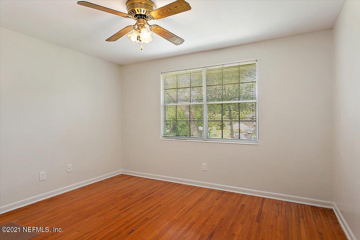 4064 Heath Road Jacksonville, FL 32277 - Photo 17 of 23 an empty room with a window and a ceiling fan
