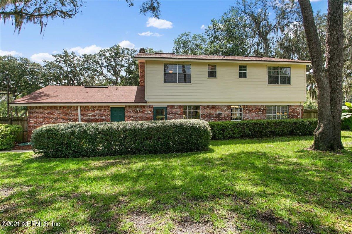 4064 Heath Road Jacksonville, FL 32277 - Photo 20 of 23 a view of backyard with a garden and plants