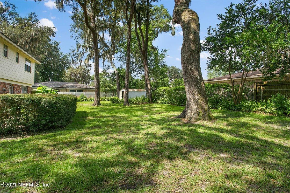 4064 Heath Road Jacksonville, FL 32277 - Photo 21 of 23 a backyard of a house with lots of green space