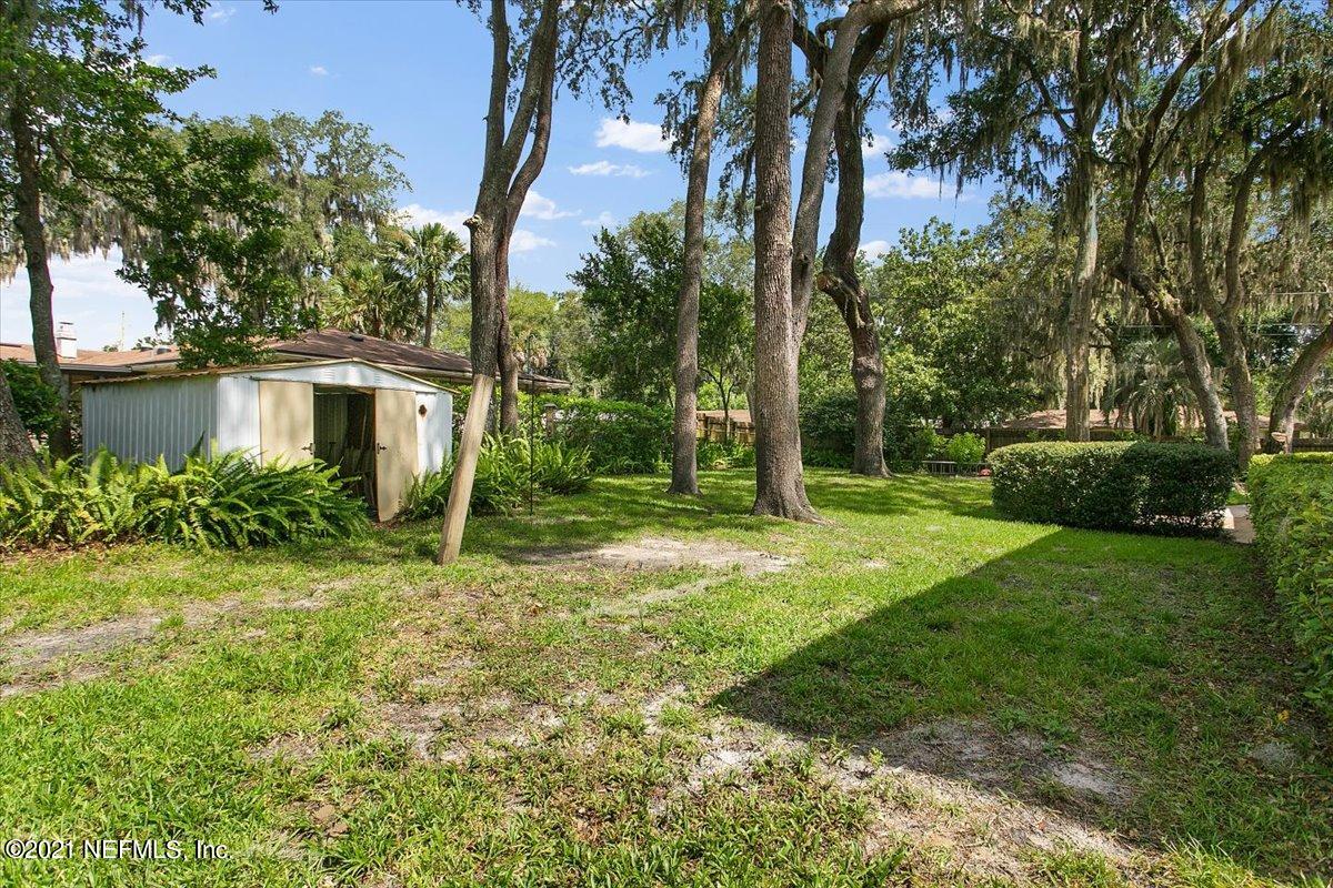 4064 Heath Road Jacksonville, FL 32277 - Photo 22 of 23 a view of a house with a backyard