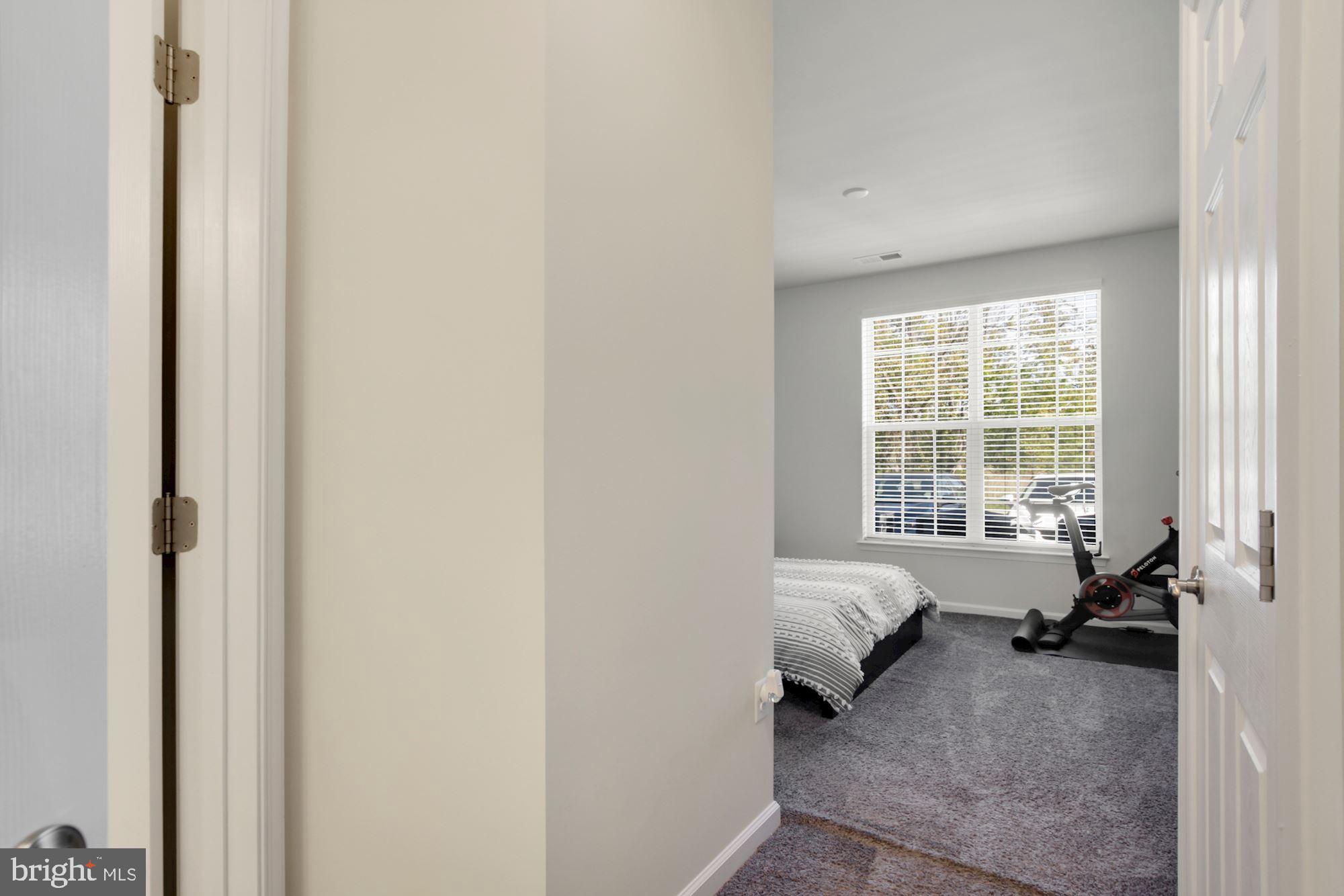 3825 Doc Berlin Drive, Unit 17 Silver Spring, MD 20906 - Photo 14 of 34 a bed room with a bed and a window