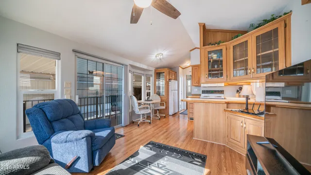 a living room with furniture and a floor to ceiling window