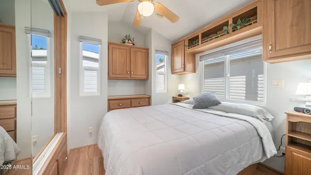 a bedroom with a bed and a cabinets