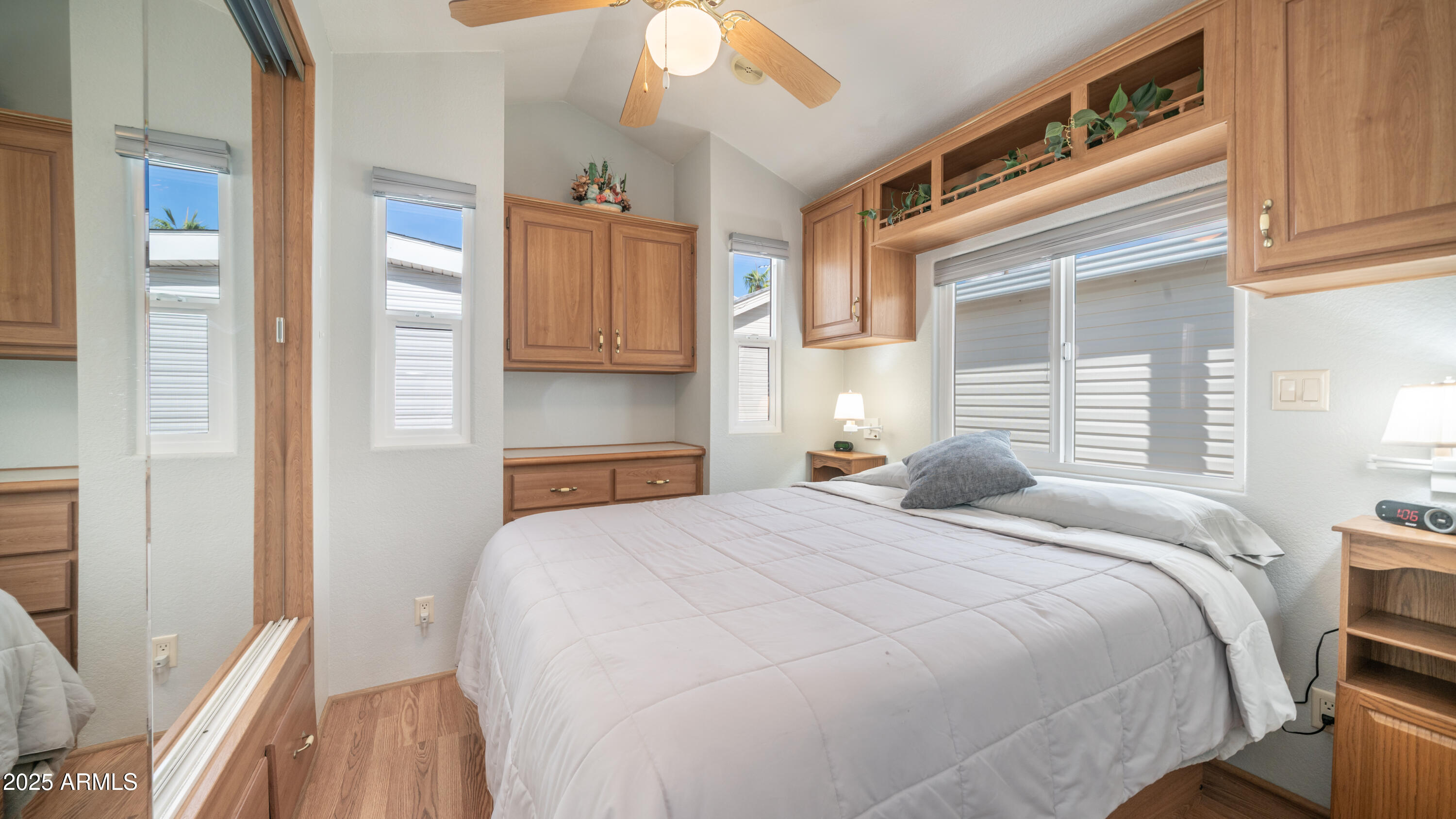 656 Gypsum Drive, Unit 656 Apache Junction, AZ 85119 - Photo 14 of 52 a bedroom with a bed and a cabinets